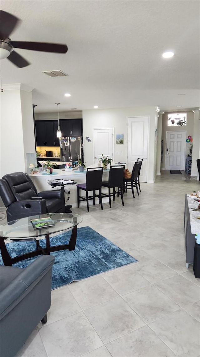 living room with visible vents, light tile patterned flooring, ceiling fan, and recessed lighting