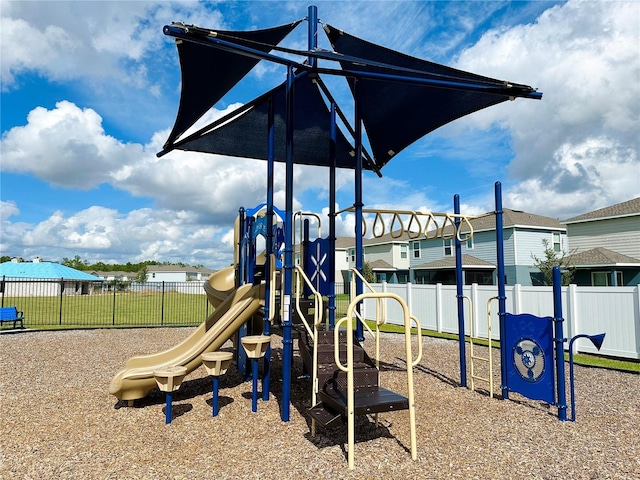 communal playground featuring fence