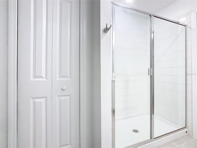 bathroom with a shower stall