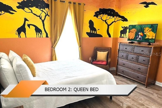 8101 Resort Village Dr Unit 31501, Orlando, FL 32821 - bedroom with wood finished floors and baseboards