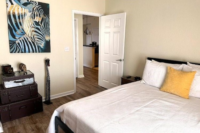 8101 Resort Village Dr Unit 31501, Orlando, FL 32821 - bedroom featuring baseboards and wood finished floors