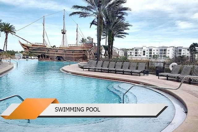 8101 Resort Village Dr Unit 31501, Orlando, FL 32821 - pool featuring a patio and fence