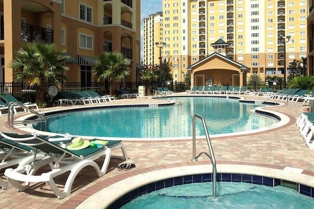 8101 Resort Village Dr Unit 31501, Orlando, FL 32821 - community pool with fence and a patio