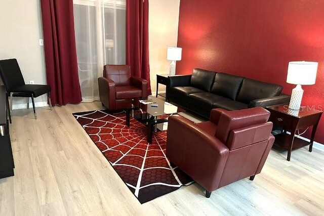 8125 Resort Village Dr Unit 51201, Orlando, FL 32821 - living area with baseboards and wood finished floors
