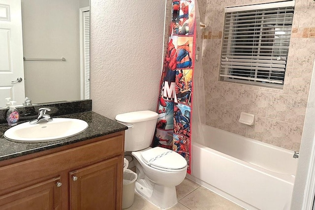 8125 Resort Village Dr Unit 51201, Orlando, FL 32821 - bathroom with toilet, shower / tub combo with curtain, tile patterned floors, vanity, and a textured wall