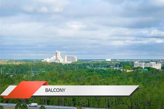 8125 Resort Village Dr Unit 51201, Orlando, FL 32821 - birds eye view of property featuring a view of trees