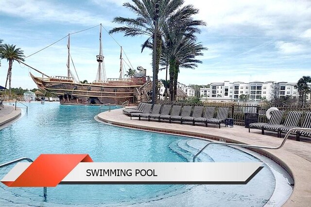 8125 Resort Village Dr Unit 51201, Orlando, FL 32821 - pool featuring fence