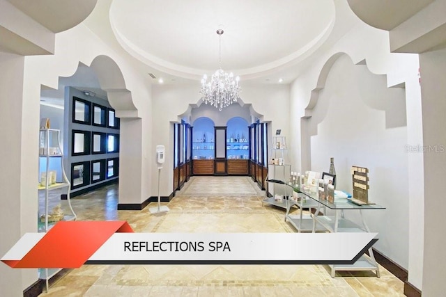 8125 Resort Village Dr Unit 51201, Orlando, FL 32821 - corridor with baseboards, a notable chandelier, recessed lighting, and a high ceiling
