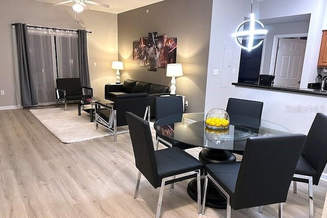 8112 Poinciana Blvd Unit 1502, Orlando, FL 32821 - dining space with baseboards, light wood-style flooring, and ceiling fan