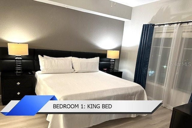 8112 Poinciana Blvd Unit 1502, Orlando, FL 32821 - bedroom featuring wood finished floors