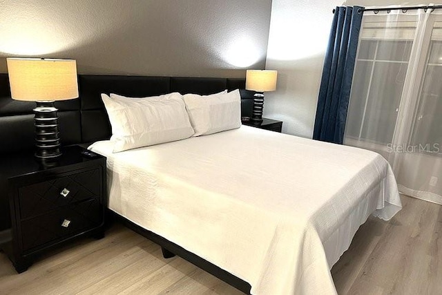8112 Poinciana Blvd Unit 1502, Orlando, FL 32821 - bedroom with light wood-style flooring