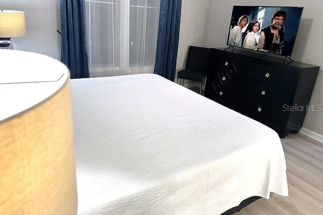8112 Poinciana Blvd Unit 1502, Orlando, FL 32821 - bedroom with wood finished floors