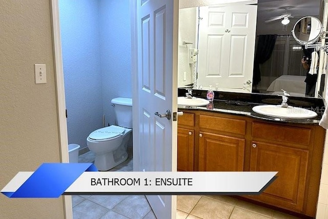 8112 Poinciana Blvd Unit 1502, Orlando, FL 32821 - full bath featuring double vanity, a sink, tile patterned floors, ceiling fan, and a textured wall