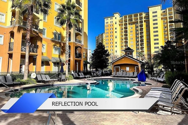 8112 Poinciana Blvd Unit 1502, Orlando, FL 32821 - community pool featuring fence