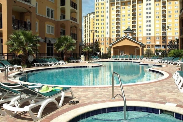 8112 Poinciana Blvd Unit 1502, Orlando, FL 32821 - pool with a patio area and fence