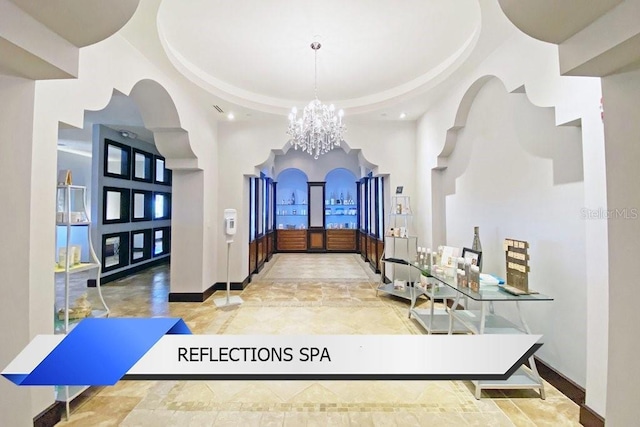 8112 Poinciana Blvd Unit 1502, Orlando, FL 32821 - corridor featuring baseboards, an inviting chandelier, recessed lighting, and a high ceiling