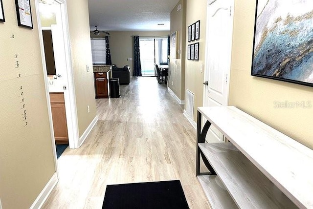 1466 Moon Valley Dr, Champions Gate, FL 33896 - hallway featuring baseboards and light wood-style floors