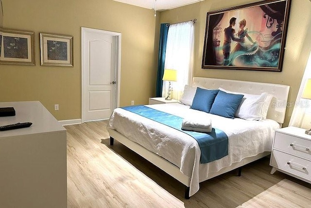 1466 Moon Valley Dr, Champions Gate, FL 33896 - bedroom with light wood-style flooring