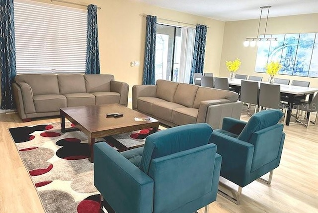 1466 Moon Valley Dr, Champions Gate, FL 33896 - living area featuring light wood-style flooring