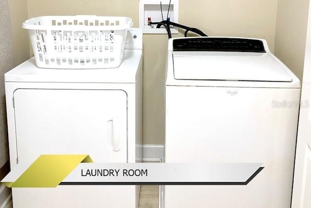 1466 Moon Valley Dr, Champions Gate, FL 33896 - washroom featuring laundry area and washer and dryer