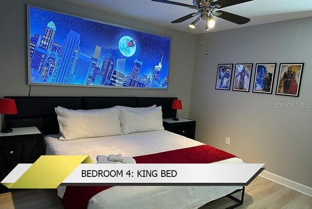 1466 Moon Valley Dr, Champions Gate, FL 33896 - bedroom with baseboards and wood finished floors