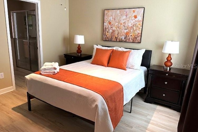 1466 Moon Valley Dr, Champions Gate, FL 33896 - bedroom with light wood-style floors and baseboards