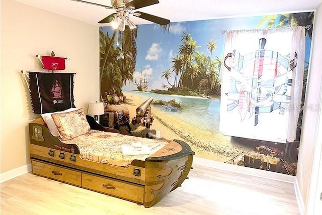 1466 Moon Valley Dr, Champions Gate, FL 33896 - bedroom with baseboards, a ceiling fan, and wood finished floors
