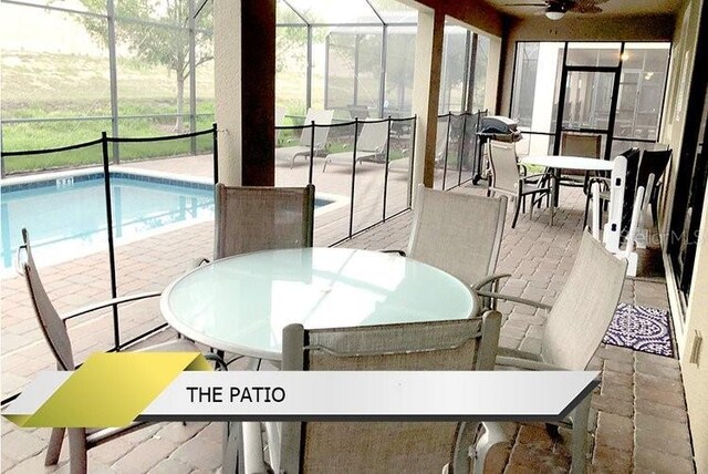 1466 Moon Valley Dr, Champions Gate, FL 33896 - sunroom / solarium featuring ceiling fan, a wealth of natural light, and outdoor dining space