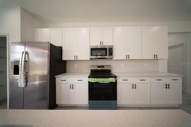 16600 SW 23rd Avenue Rd, Ocala, FL 34473 - kitchen featuring light countertops, white cabinets, and appliances with stainless steel finishes