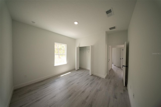 16600 SW 23rd Avenue Rd, Ocala, FL 34473 - unfurnished bedroom featuring a closet, light wood-type flooring, visible vents, and baseboards
