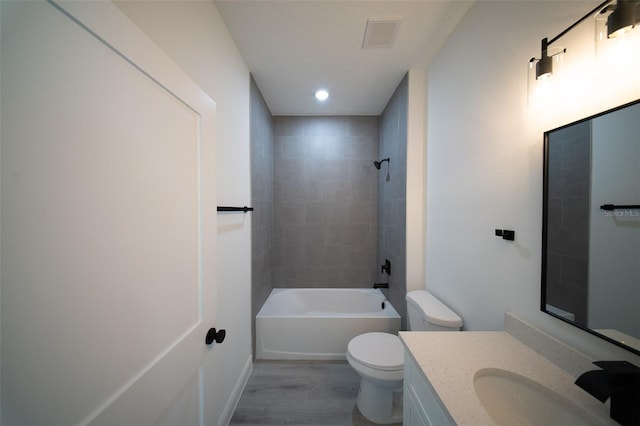 16600 SW 23rd Avenue Rd, Ocala, FL 34473 - bathroom with toilet, wood finished floors, shower / tub combination, visible vents, and vanity