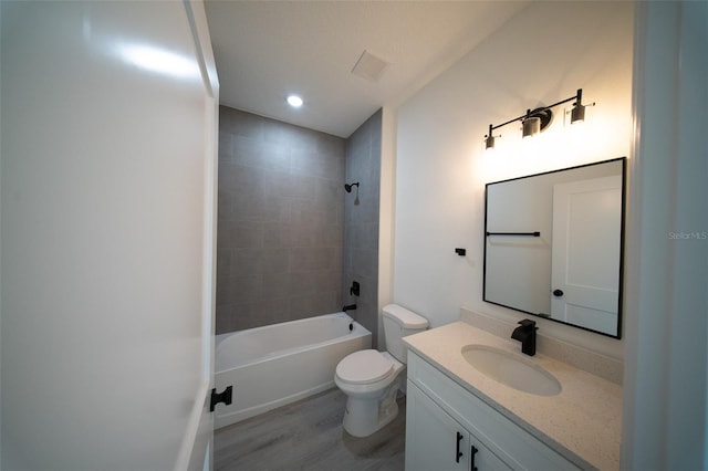 16600 SW 23rd Avenue Rd, Ocala, FL 34473 - full bath with toilet, shower / washtub combination, wood finished floors, vanity, and recessed lighting
