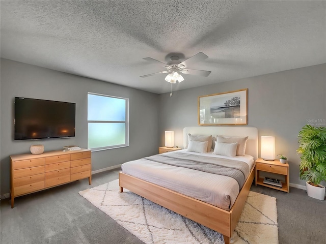 2708 La Posada Dr, The Villages, FL 32162 - carpeted bedroom featuring baseboards, a textured ceiling, and a ceiling fan