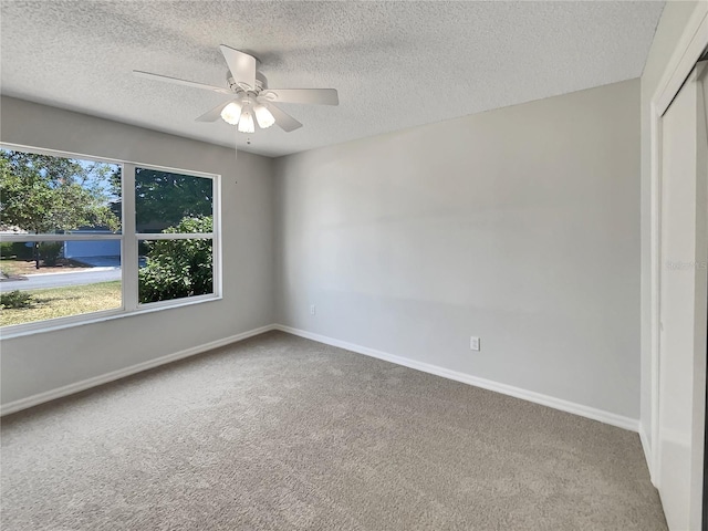 2708 La Posada Dr, The Villages, FL 32162 - carpeted spare room with ceiling fan, a textured ceiling, and baseboards