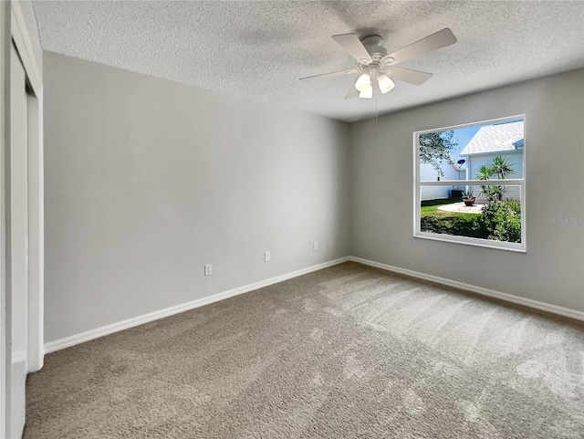2708 La Posada Dr, The Villages, FL 32162 - empty room with baseboards, carpet flooring, a ceiling fan, and a textured ceiling