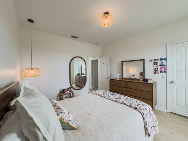 bedroom featuring light wood finished floors