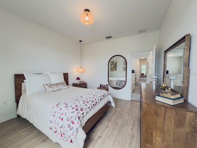 bedroom featuring light wood finished floors