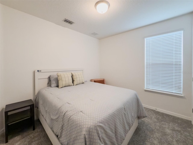 bedroom with carpet floors and baseboards