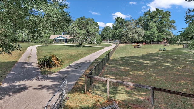 view of property's community with view of wooded area