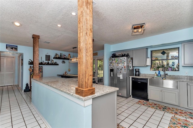 kitchen featuring decorative columns, stainless steel refrigerator with ice dispenser, black dishwasher, a sink, and light tile patterned floors