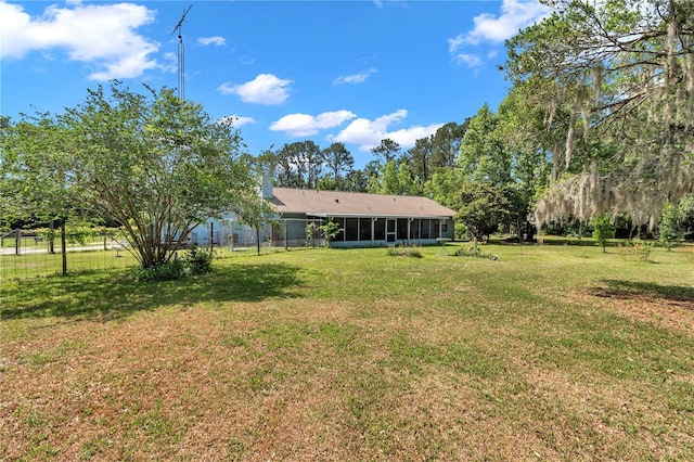view of yard featuring a sunroom
