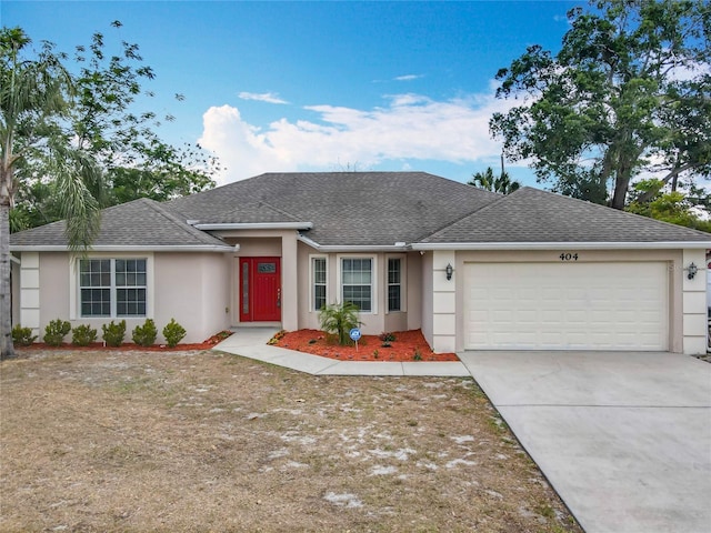 ranch-style house featuring driveway, stucco siding, roof with shingles, and a garage