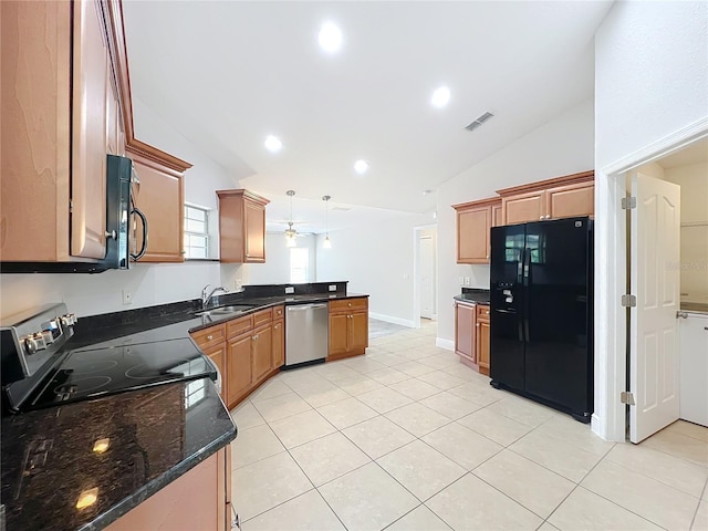 kitchen with a peninsula, light tile patterned floors, visible vents, black appliances, and lofted ceiling