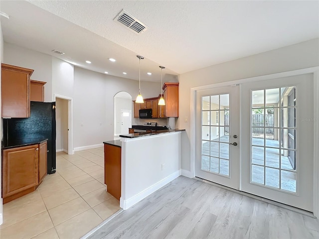 kitchen with french doors, dark countertops, visible vents, baseboards, and black microwave