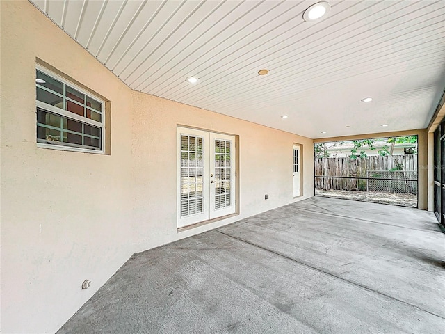 view of patio / terrace featuring fence and french doors