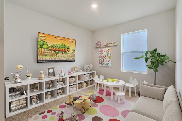 rec room featuring carpet flooring