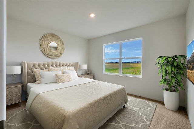 carpeted bedroom with baseboards