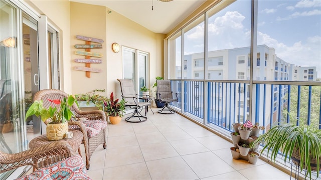 sunroom featuring tile patterned floors