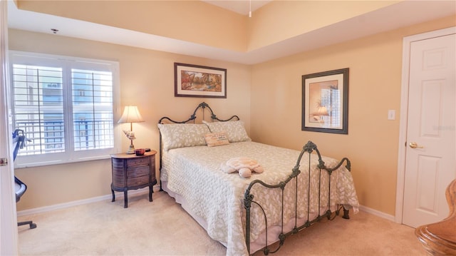 bedroom with baseboards and carpet floors