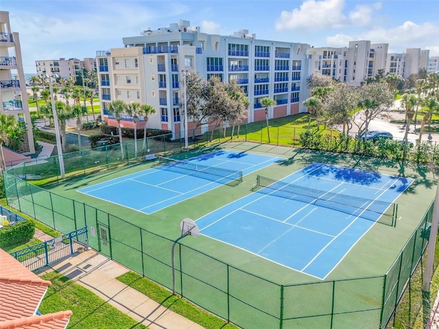view of sport court featuring fence